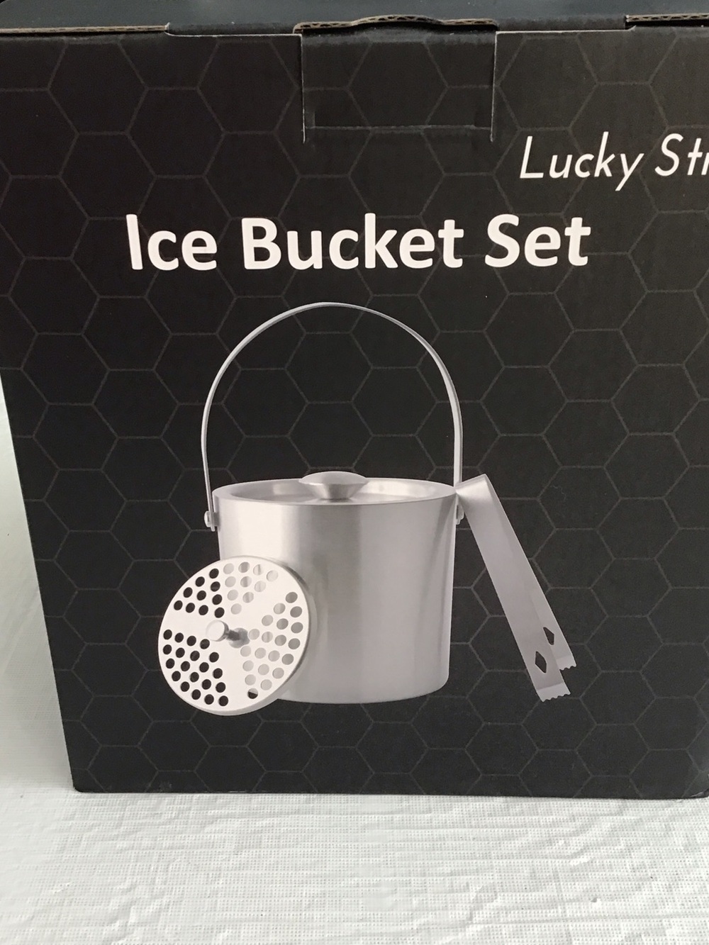 Ice Bucket includes Strainer, and tongs. ##
